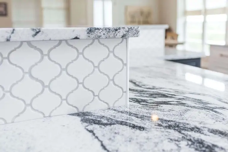 Detailed view of custom-designed tile installation on a kitchen island.